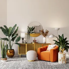 Our indoor plant styling service brings life into your home. Here, we selected a variety of hardy indoor plants like the snake plant and bird of paradise, placing them in statement pots to complement the modern, warm interior design.