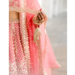 A close-up on tradition. This shot focuses on the bride's hand, adorned with henna and her kalire. These small, beautiful details are an essential part of the bridal story I help to style.