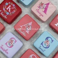 Your elegant jewelry deserves effortless portability. These adorable and colorful trinket boxes are perfect for travel and can be personalized with a floral initial and name.