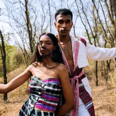 A dynamic outdoor shot from the 'Nazaar' editorial, capturing movement and energy as wind blows through the model's hair.