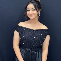 The full look, pairing the creative eye makeup with a simple black dress to make the colors pop.