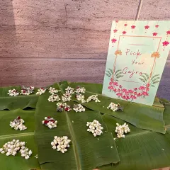 A thoughtful and traditional welcome for guests. We set up this "Pick Your Gajra" station with fresh jasmine flowers beautifully arranged on banana leaves, adding a fragrant and personal touch to the celebration.