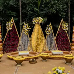 A stunning and symmetrical Haldi decor setup. This shot highlights the thoughtful design and vibrant colors that create a festive atmosphere.