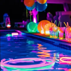 A "Luminous Lagoon" themed pool party. We used neon lights, glow sticks, and colorful glowing drinks to transform the pool area into a vibrant, otherworldly celebration.