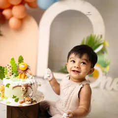 The pure, unfiltered joy of a first birthday cake smash. This is what it's all about: sweet smiles, messy fingers, and a memory that will be cherished long after the cake is gone.