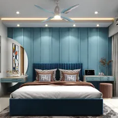 Your bedroom should be your personal sanctuary. Here, we've used a calming blue palette, a plush upholstered headboard, and layered lighting to create a tranquil and stylish retreat. This design balances bold color with soft textures for a perfectly serene master bedroom.