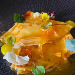 A beautiful plate of Crepes Suzette, a timeless French dessert that I love to prepare.