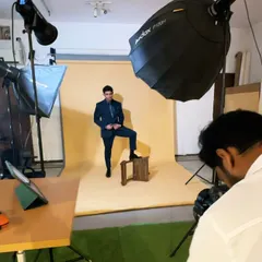 A look at our studio setup for a formalwear shoot, complete with a seamless paper background, lighting, and a tethered shooting station to review images instantly.