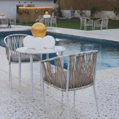 Simple and chic poolside seating. This is a great spot to relax with a drink, enjoy some food, and watch the fun happening in the pool.