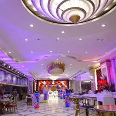 A wide-angle view showing how my decorations can transform a large banquet hall. The main stage for Kavya's birthday serves as a stunning focal point for the entire room.
