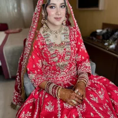 A full portrait of my beautiful bride Nabeela, looking absolutely radiant in her traditional red wedding attire.