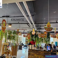 Diwali decorations for a salon, using hanging diyas and creeper garlands to create a warm and festive atmosphere for clients and staff.