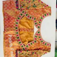 This is the back of the blouse shown earlier (ID 5). It has a unique cutout shape, and the heavy embroidery continues all around for a complete look.