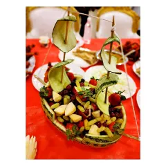 Catering imagination at its finest. Here, I have transformed a watermelon into a beautiful sailboat, complete with cucumber sails and filled with a fresh fruit salad.