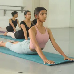 In our Stretch & Beyond class, we use mats for floor exercises that target key muscle groups. Here, students work on back flexibility and strength with a controlled cobra pose.
