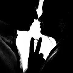 A creative silhouette shot from an engagement ceremony. I use techniques like this to create unique, artistic images that symbolize the couple's union, focusing on the ring that marks their promise.