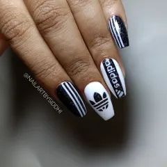 A full hand view of the Adidas-themed press-on nails, showing the complete, sporty design.