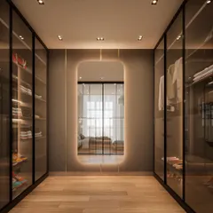 This is what couple closet goals look like. We designed this walk-in closet to be a dreamy, organized space, complete with a large, backlit mirror that adds a touch of glamour and makes the space feel larger.