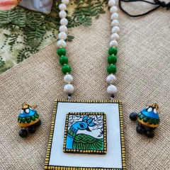 Here is the same Gond art inspired deer necklace in a striking green and blue combination. Offering multiple colorways of a popular design allows resellers to cater to diverse customer preferences.