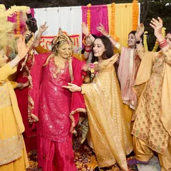 The bride dancing with her family and friends during her Haldi ceremony. These are the unscripted, chaotic, and beautiful moments that make the best memories.