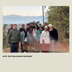 Our group pausing during a walk, with the magnificent snow-capped Dhauladhar mountain range in the background. Being in the presence of such natural grandeur is a humbling and centering experience.