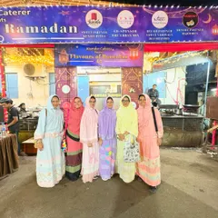A group of women from the Bohra community dressed in their traditional ridas, posing for a photo outside our venue.