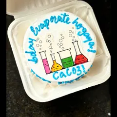 A nerdy and fun cake for a science lover! This design features colorful cartoon beakers and a funny chemistry-related Hindi phrase, "evaporate ho gaya."