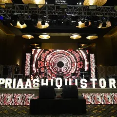 We bring your brand to the forefront with custom stage designs and branded elements. This stage for a corporate celebration features a dynamic LED backdrop with custom graphics and illuminated lettering of the event hashtag, creating a high-energy focal point.