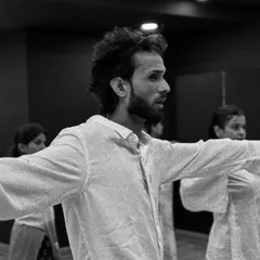 A black and white close-up of our instructor, Akshay, demonstrating a move with intense focus and emotion.