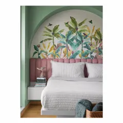 A child's room should be a world of imagination. For this bedroom, we created a custom tropical wallpaper that rises from behind a candy-floss pink headboard. The sage green walls and arched alcove create a magical, playful environment for a growing child.