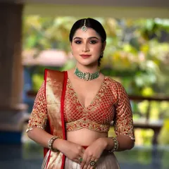 A full view of the V-neck bridal blouse, showing how it pairs perfectly with a Kanchi Pattu half saree.