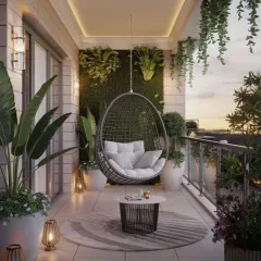 A popular feature we incorporate is the hanging swing chair, creating a perfect reading nook. In this urban balcony design, we paired it with a vertical moss wall and layered plants in weatherproof planters for a serene, resort-like feel.