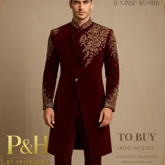 A closer look at the opulent hand-embroidery on my dark maroon velvet Angrakha. This design is inspired by royal Indian attire, tailored for a groom seeking a majestic and unforgettable presence.