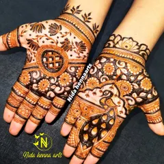 A beautiful design created for the Teej festival. It features a peacock on one hand and a floral mandala on the other, blending traditional motifs in a unique way.