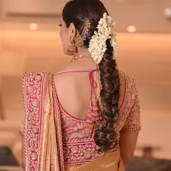 I have a special love for creating traditional hairstyles, like this intricate South Indian bridal braid, beautifully woven with fresh jasmine flowers for a fragrant and authentic touch.
