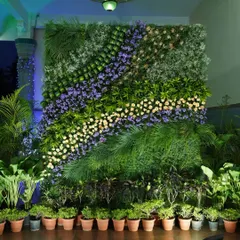 I designed this intricate floral wall with diagonal bands of different flowers and greenery. The varied textures and colors create a unique, artistic backdrop that brings the feel of a vertical garden indoors.