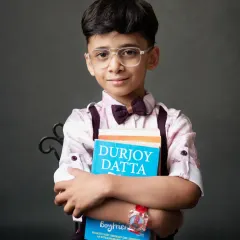 A smart and studious look for this young man, posing with his favorite book.