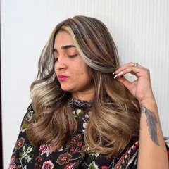 Adding color adds confidence. These chunky blonde highlights create a bold, face-framing effect that is totally on-trend.