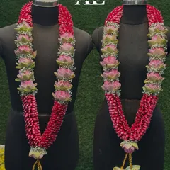 This is my signature wedding garland set. I use fragrant rose petals and delicate pink lotus buds to create a matching pair of varmalas that are perfect for the bride and groom.