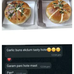 Two of my classic garlic buns packed and ready for delivery. The customer's message shows just how tasty they are when served warm.