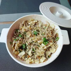 For those who love spicy salads, this is Manipuri Singju. It's a mix of finely chopped vegetables, herbs, and roasted powders, with a fiery kick from the chillies.