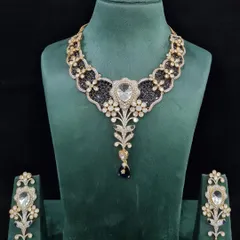 The Victorian-inspired necklace set in a striking blue, complete with matching earrings. This design is perfect for receptions or cocktail parties.