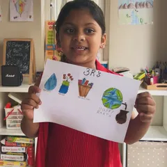 This little eco-artist is showing off her drawing that illustrates the power of recycling. We believe in teaching important values through creativity.