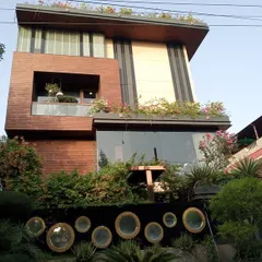 A full view of a modern villa in Noida where I designed and installed integrated greenery on the ground floor, balconies, and a full rooftop garden.