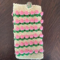 This mobile pouch features pretty pink tulips on a cream background, offering a soft and feminine way to carry your phone.
