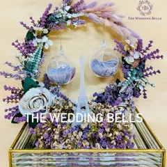 Paris isn't just a place, it's a feeling. This Paris-themed ring platter, with a miniature Eiffel Tower and lavender florals, brings that romance to your engagement.