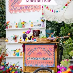 A vibrant and festive Mocktail Bar for a Mehendi party. We designed this colorful station, complete with a custom cart and fun glassware, to keep guests refreshed in style.