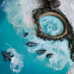 Bring the calm of the ocean into your home. This stunning resin ocean art, with its 3D details like a small hut and stepping stones, is a perfect decor piece that captures the beauty of a seaside escape.