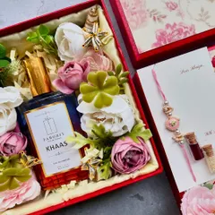 This Rakhi hamper includes a bottle of 'Khaas' perfume, adding a fragrant and luxurious touch to the traditional gift set.