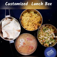 For my regular subscribers, I deliver daily lunch in these convenient steel tiffin carriers. This box contains chapatis, two different vegetable preparations, and a flavorful dal, keeping your meal fresh and warm, just like it was packed at home.
